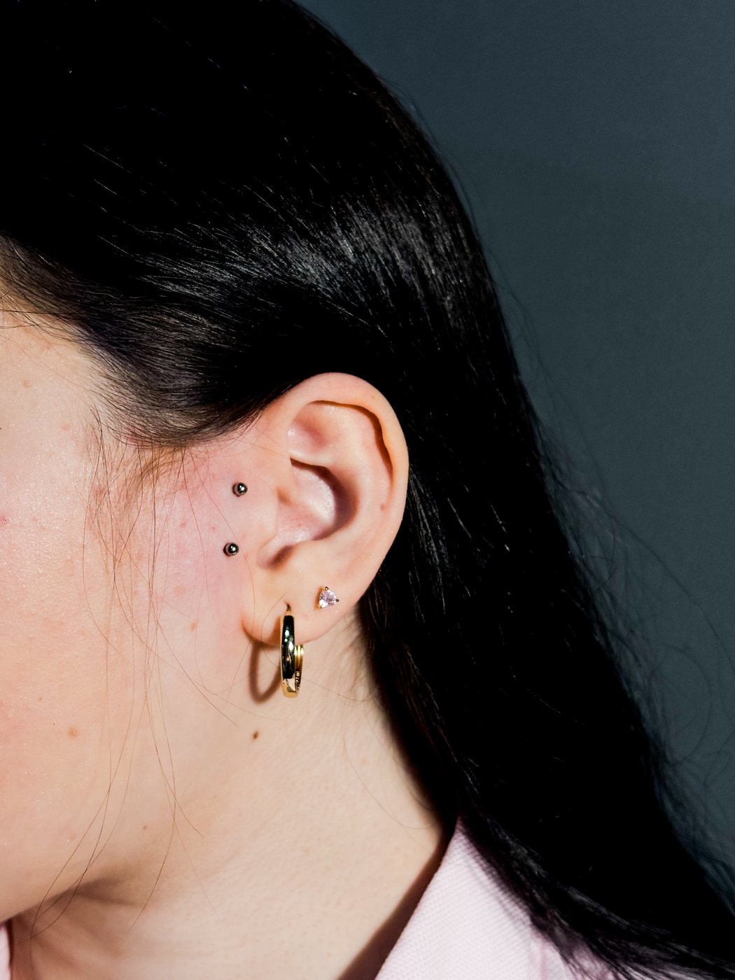anti tragus studs in front of the ear, hoop in the lobe
