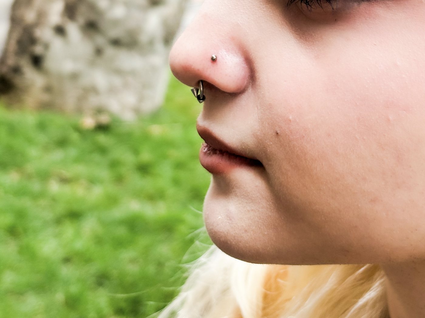 nostril stud, blonde hair, outdoors